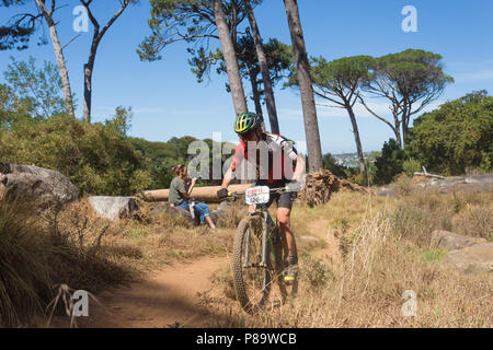 mountain biker on Cape Epic 2018 course with spectators in Cape Town, South Africa Stock Photo