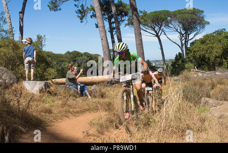 Cape Epic 2018 cyclists on tough endurance course on slopes of Table Mountain with spectators in Cape Town, South Africa Stock Photo