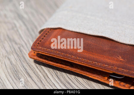 Leather Wallet on wooden table Stock Photo