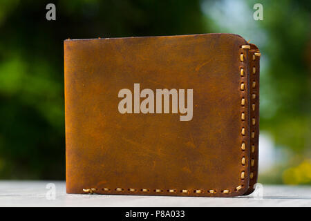 Leather Wallet on wooden table Stock Photo