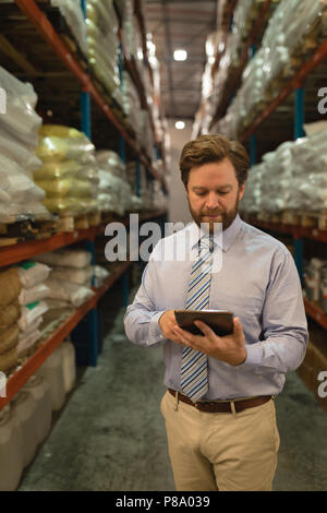 Male manager using digital tablet Stock Photo
