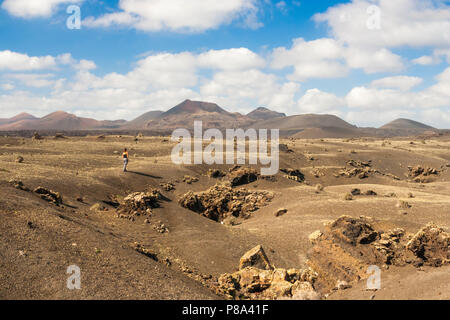 Female hiker in Timanfaya National Park on Lanzarote, Canary Islands, Spain Stock Photo