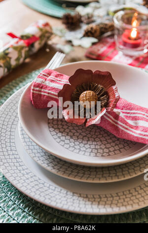 Floral napkin ring on patterned bowl in regency home Stock Photo
