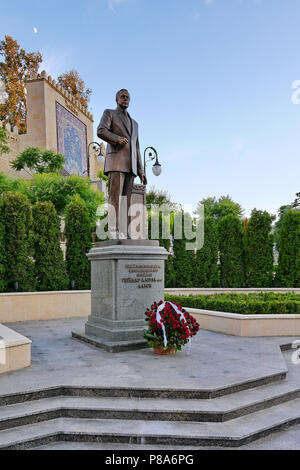 a monument to famous politician Heydar Aliyev with flowers at the foot. Kiev. Ukraine . For your design Stock Photo