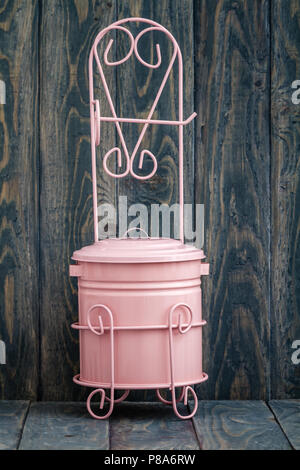 Small pink metal trash box for bathroom Stock Photo
