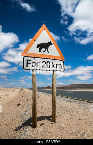 Road sign warning of brown hyaena, Namibia Stock Photo