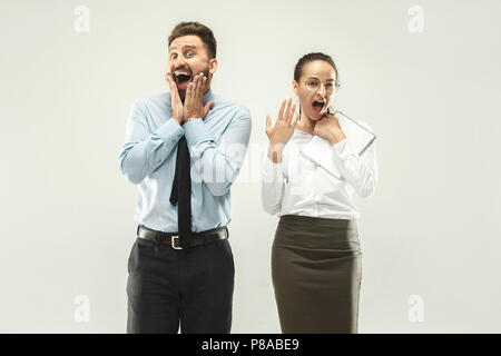 Happy boss. Man and his secretary standing at office Stock Photo