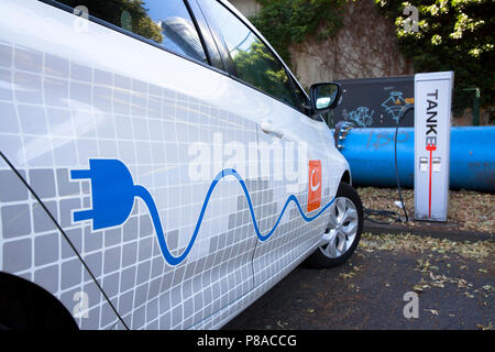 Renault ZOE of the carsharer Cambio at a charging station of the Mobilstation on the Charles-de-Gaulle square in the district Deutz, Cologne, Germany. Stock Photo