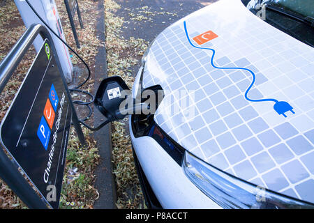 Renault ZOE of the carsharer Cambio at a charging station of the Mobilstation on the Charles-de-Gaulle square in the district Deutz, Cologne, Germany. Stock Photo