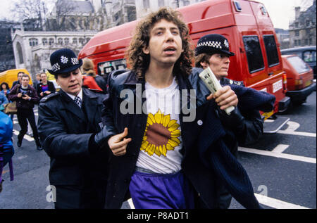 Earth First Activist Being Arrested at Rainforest Protest outside Houses of Parliament, London, England, UK, GB. Stock Photo