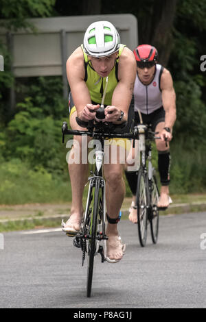 Male competitor in the bike segment in the 2018 Hague Endurance Festival Olympic Triathlon Stock Photo