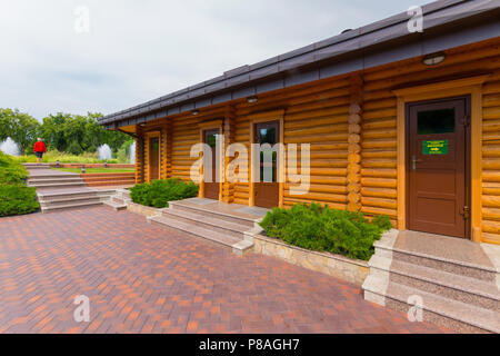 elegantly made neat building of logs and an ideally paved area in front of him . For your design Stock Photo