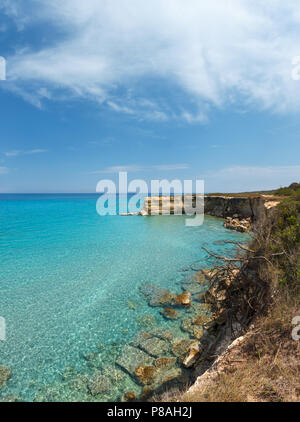 Picturesque seascape with white rocky cliffs and sea bay at beach Spiaggia della Punticeddha, Salento Adriatic sea coast, Puglia, Italy. Stock Photo