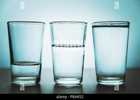 https://l450v.alamy.com/450v/p8ak52/studio-shot-of-three-water-glasses-each-one-have-more-water-than-the-other-p8ak52.jpg