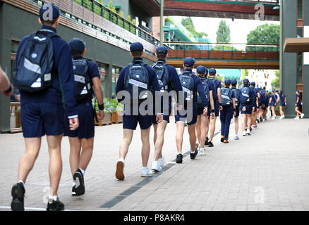 Ball boys and girls around the grounds at the start of day eight of the Wimbledon Championships at the All England Lawn Tennis and Croquet Club, Wimbledon. Stock Photo