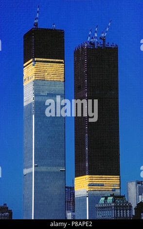 A close-up of the original World Trade Center’s Twin Towers under construction in 1971 as seen from the Hudson River in New York City, New York, USA. The building of the North Tower (left) began in 1968 and the South Tower in 1969. Both structures had been completed and occupied for a decade before they collapsed on September 11, 2001, after being struck by two passenger jetliners hijacked by terrorists. A total of 2,606 people died in the buildings during the disaster. At one time these towering twin structures of the first World Trade Center (WTC) were the tallest buildings in the world. Stock Photo