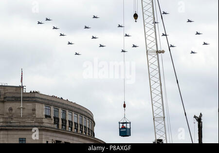 22 RAF Typhoons form the number 100 as they fly in formation over central London to mark the centenary of the Royal Air Force. Stock Photo