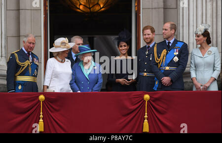 (left to right) The Prince of Wales, Duchess of Cornwall, Queen Elizabeth II, Duchess of Sussex, Duke of Sussex, Duke of Cambridge and Duchess of Cambridge on the balcony at Buckingham, Palace where they watched a Royal Air Force flypast over central London to mark the centenary of the Royal Air Force. Stock Photo