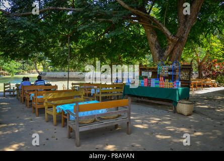 Inle Lake, Myanmar - Feb 7, 2018. Wooden chairs and tables at outdoor coffee shop on Inle Lake, Myanmar. Stock Photo