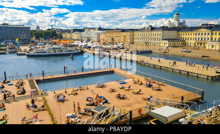 Helsinki, Finland 7.7.2018 Allas Sea Pool, Market Square, Presidental Palace and behind Helsinki Lutherdal Catetral . Suomenlinna ferry on the seaside. Stock Photo