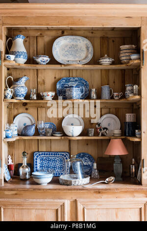 Blue and white chinaware on wooden dresser