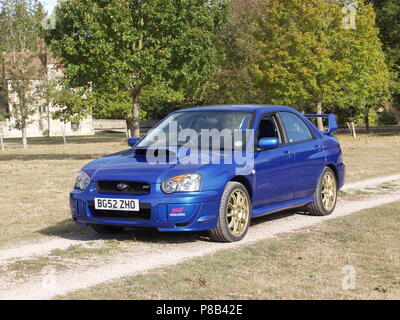 Subaru Impreza WRX STI in WR blue pearl colour with alloy wheels - showing front and side view Stock Photo