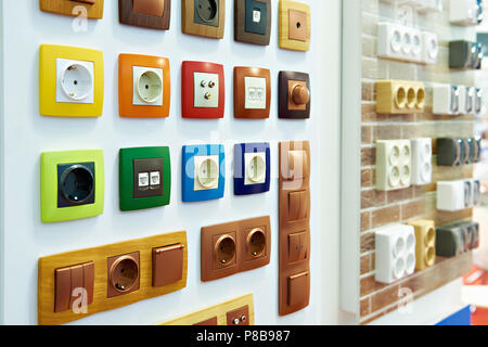 Wall mounted colored electrical outlets for indoor installation Stock Photo