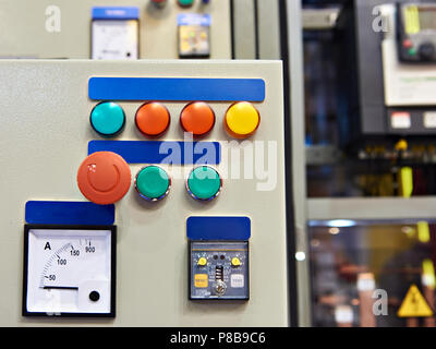 Equipment and systems control stand in industrial plant with different buttons Stock Photo