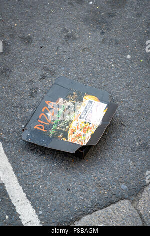 Discarded Pizza box in the road Stock Photo