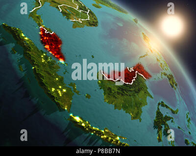 Sunset above Malaysia from space on planet Earth with visible country borders. 3D illustration. Elements of this image furnished by NASA. Stock Photo