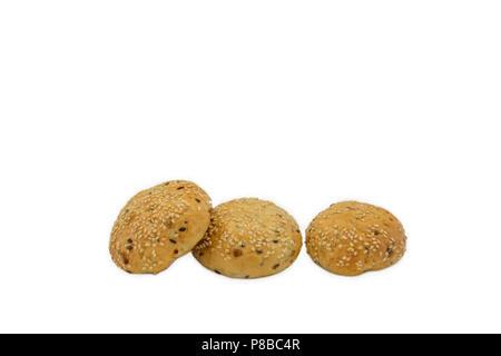 Rolls with sesame and raisin on white background, isolated, three pieces Stock Photo