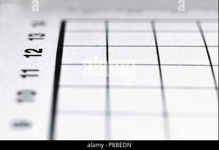 Unusual point of view for a crossword paper ,geometric composition ,macro photography ,number 12 in focus ,horizontal lines Stock Photo