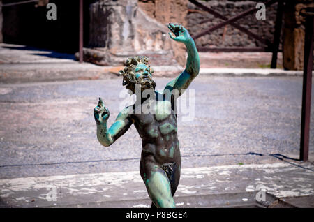 the bronze statue of the faun or dancing satire. Pompeii Stock Photo