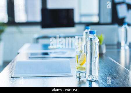 bottles and glasses with antioxidant drink for business meeting in office Stock Photo