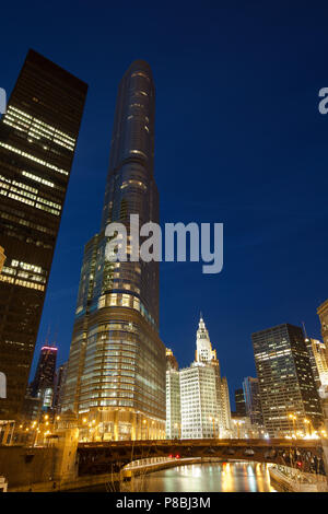 Chicago, Illinois, United States - Trump International Hotel and Tower and downtown city skyline at night. Stock Photo