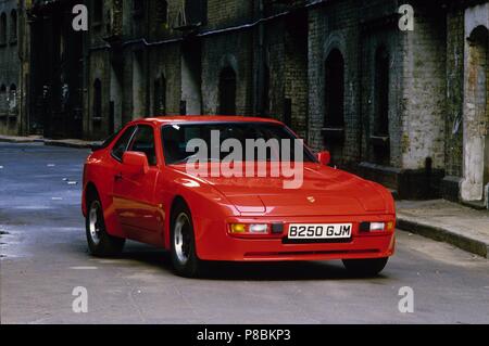 Porsche 944 - 1985 model year shown in guards red paint in an urban setting Stock Photo
