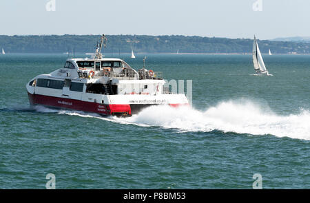 Red Jet 4 a catamaran passenger service between Southampton and Cowes, Isle of Wight, UK. underway on the Solent bound for Cowes Stock Photo