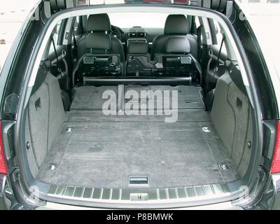Porsche Cayenne Turbo 2003 model Fast SUV - showing large cargo boot trunk space with rear seats folded down to expand capacity Stock Photo