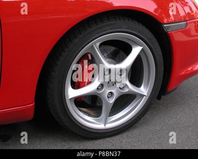 Porsche Boxster S in Red - 2002 model - showing close up of alloy wheel and brake calipers painted Stock Photo