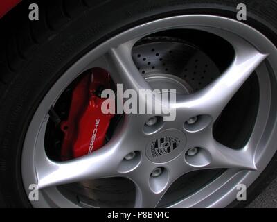 Porsche Boxster S in Red - 2002 model - showing close up of alloy wheel and brake calipers painted Stock Photo