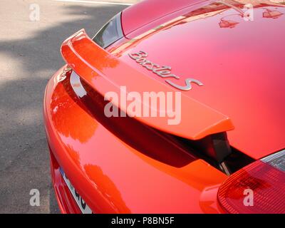 Porsche Boxster S in Red - 2002 model - showing rear spoiler activated and up for aerodynamics Stock Photo