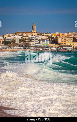Beautiful Spanish village Palamos in Costa Brava with big waves Stock Photo