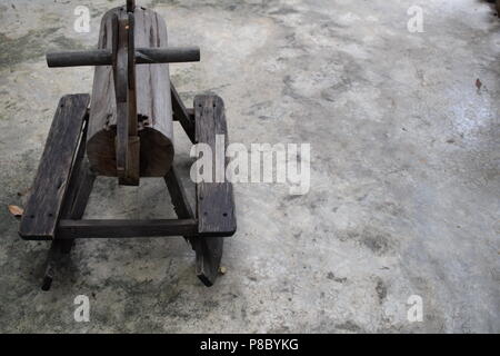 old wood rocking horse for children were left on the concrete floor Stock Photo