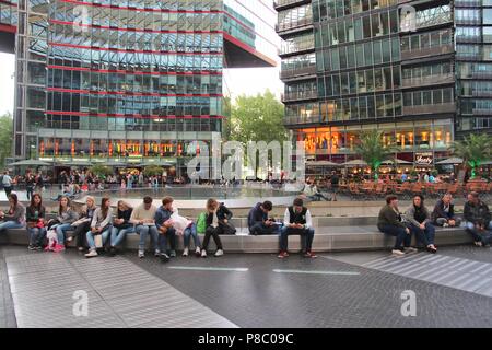 BERLIN, GERMANY - AUGUST 26, 2014: People visit Sony Center in Berlin. The modern complex was completed in 2000 and is Sony European headquarters. Stock Photo