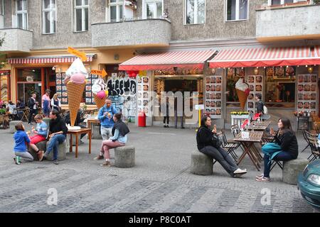 BERLIN, GERMANY - AUGUST 26, 2014: People dine out in Wrangelkiez area of Kreuzberg district in Berlin. 11.3 million guests visited Berlin in 2014. Stock Photo