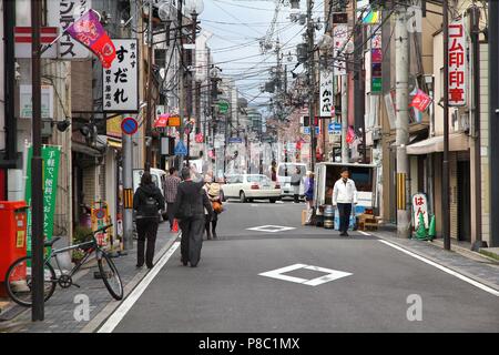 KYOTO, JAPAN - APRIL 14, 2012: People visit Gion district in Kyoto, Japan. 13,413,600 foreign tourists visited Japan in 2014. Stock Photo