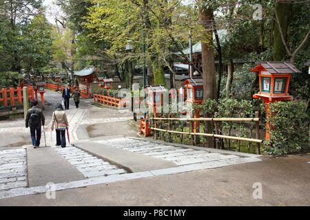 KYOTO, JAPAN - APRIL 14, 2012: Tourists visit Yasaka shrine gardens in Kyoto, Japan. Old Kyoto is a UNESCO World Heritage site and was visited by almo Stock Photo