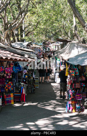 PUERTO VALLARTA, MEXICO - MARCH 10, 2018:  Colorful souvenirs on sale to tourists at the Cuale Island Flea Market, March 10, 2018. MX-JAL. Stock Photo