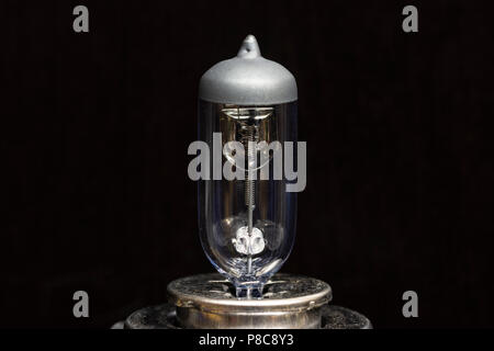 Close up of a motor vehicle halogen light bulb. isolated on a black background. Stock Photo