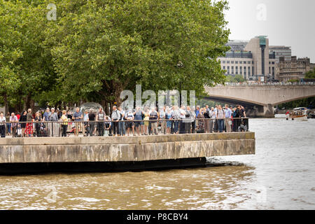 London, UK. 10th July, 2018. People gather along the River Thames to watch the RAF 100 Flypast in London, UK on July 10th 2018 Credit: Nick Whittle/Alamy Live News Stock Photo
